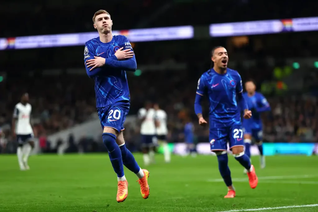 Cole Palmer celebrates after scoring a penalty against Tottenham