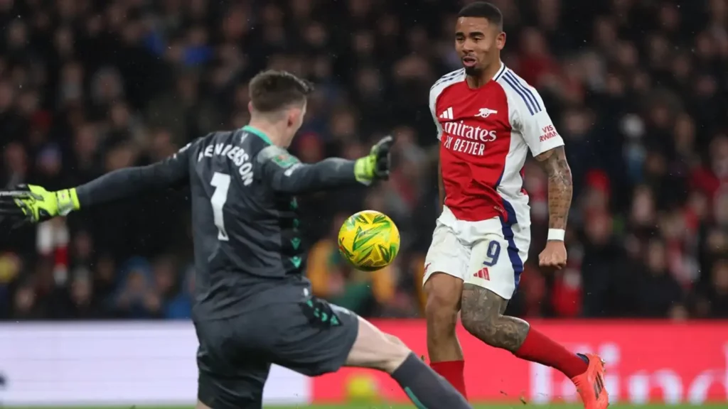 Gabriel Jesus chips the ball over Dean Henderson