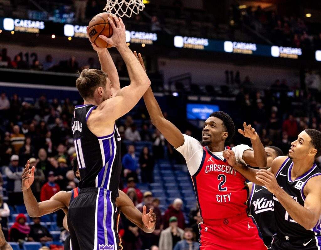 Domantas Sabonis grabs a rebound in the NBA game against New Orleans Pelicans