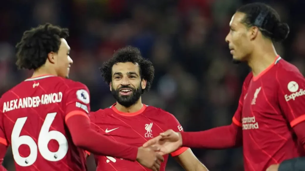 Salah, Van Dijk, and Alexander-Arnold celebrate Liverpool goal