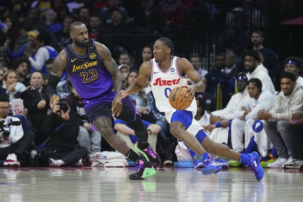 Tyrese Maxey guarded by LeBron James