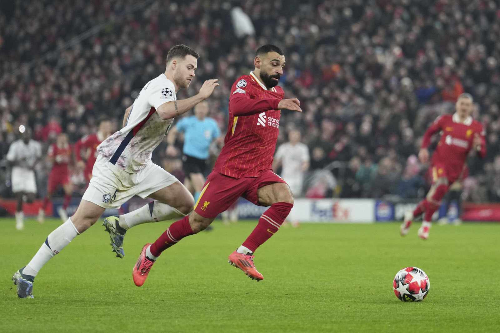 Mohamed Salah sprinting with the ball at his feet