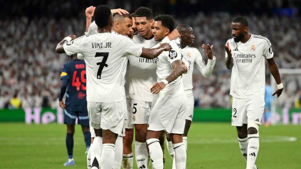 Real Madrid players celebrate after scoring against Salzburg