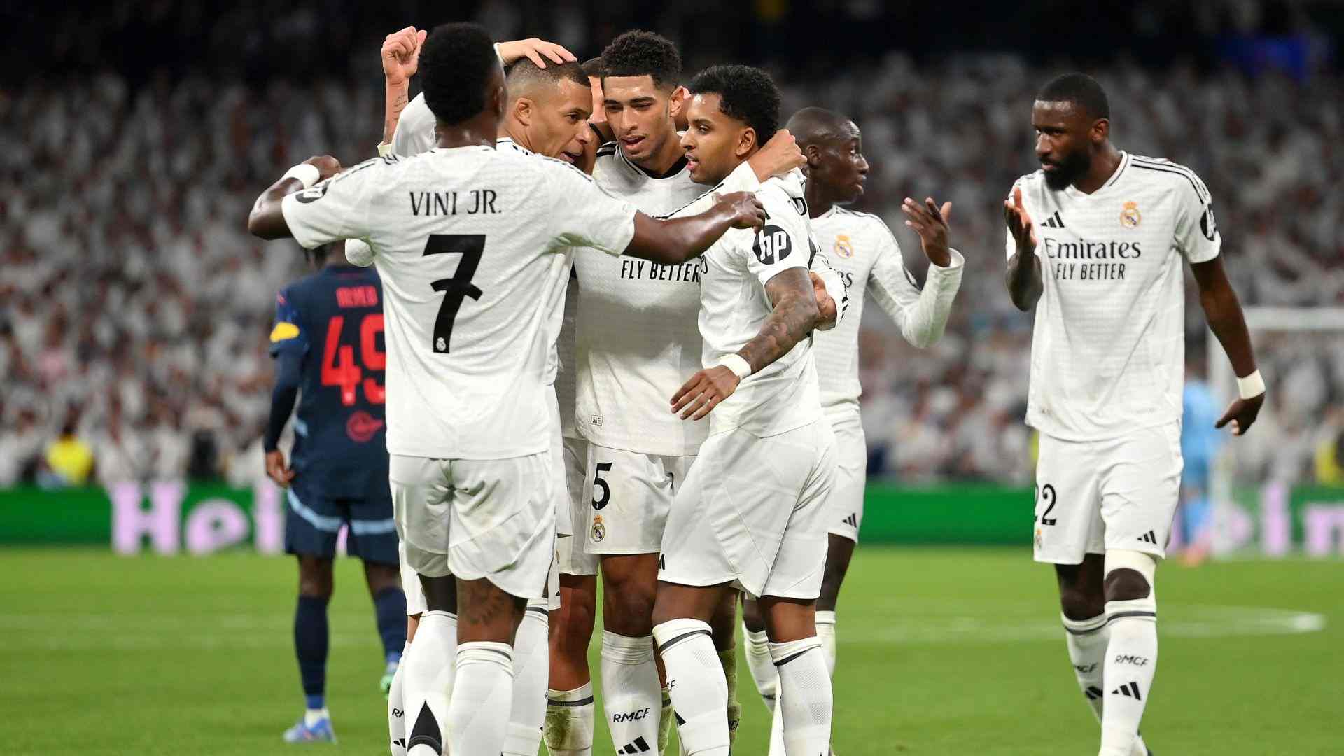 Real Madrid players celebrate after scoring against Salzburg