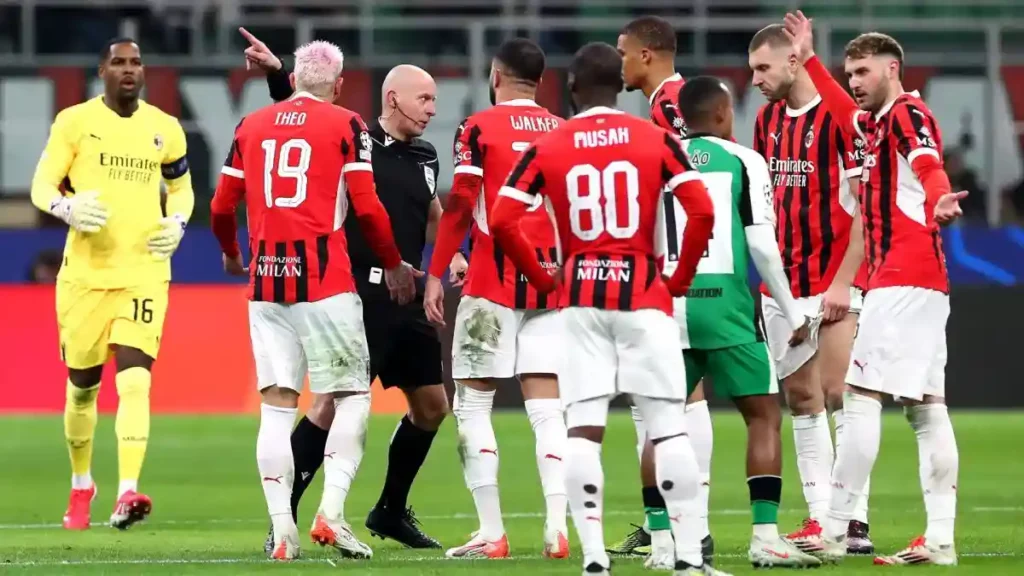 AC Milan players surrounding the referee in the Champions League game agaisnt Feyenoord