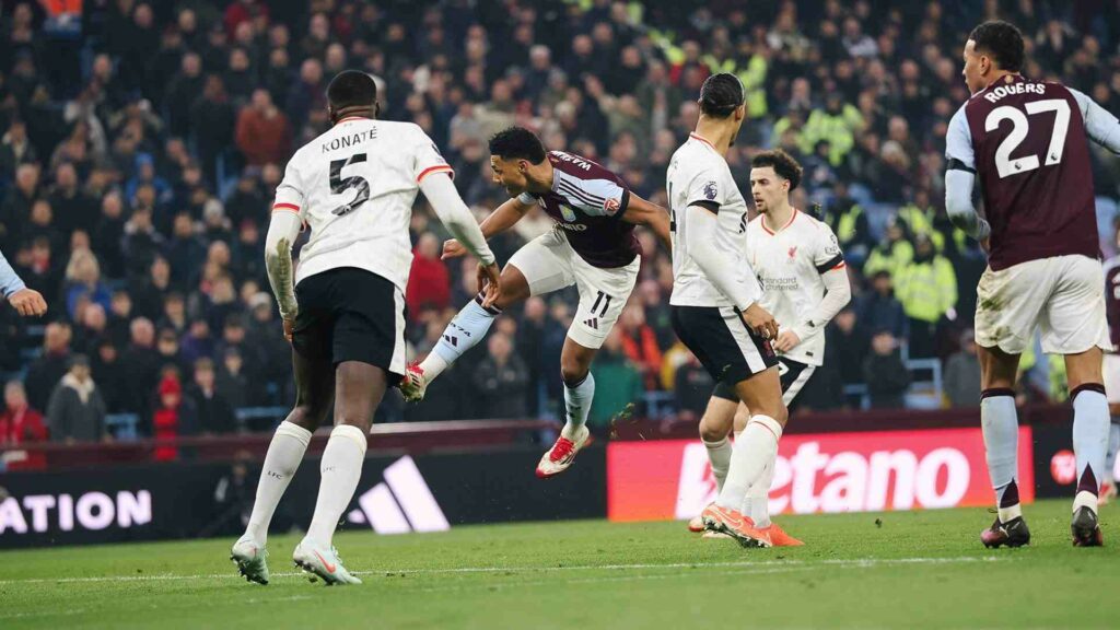 Ollie Watkins heads the ball