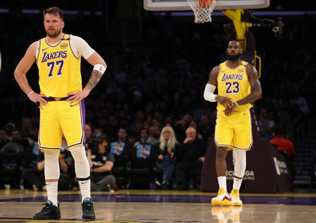 Luka Doncic and LeBron James during Lakers' loss to Charlotte Hornets