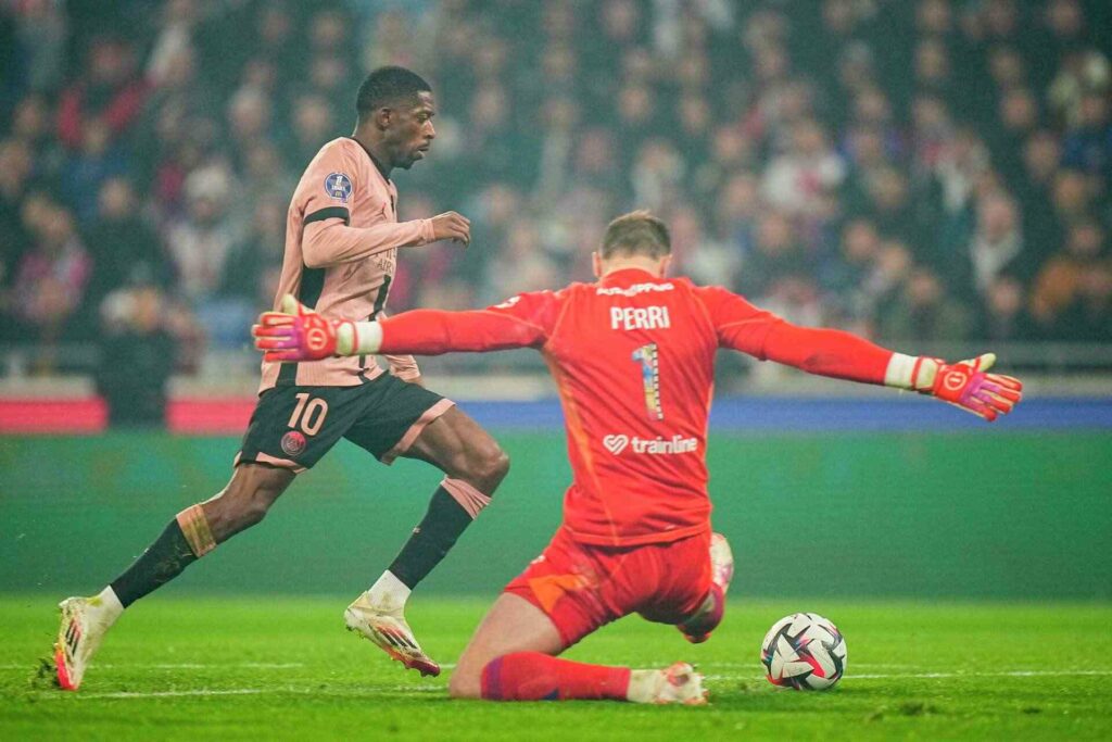 Ousmane Dembele trying to round off Lyon's goalkeeper