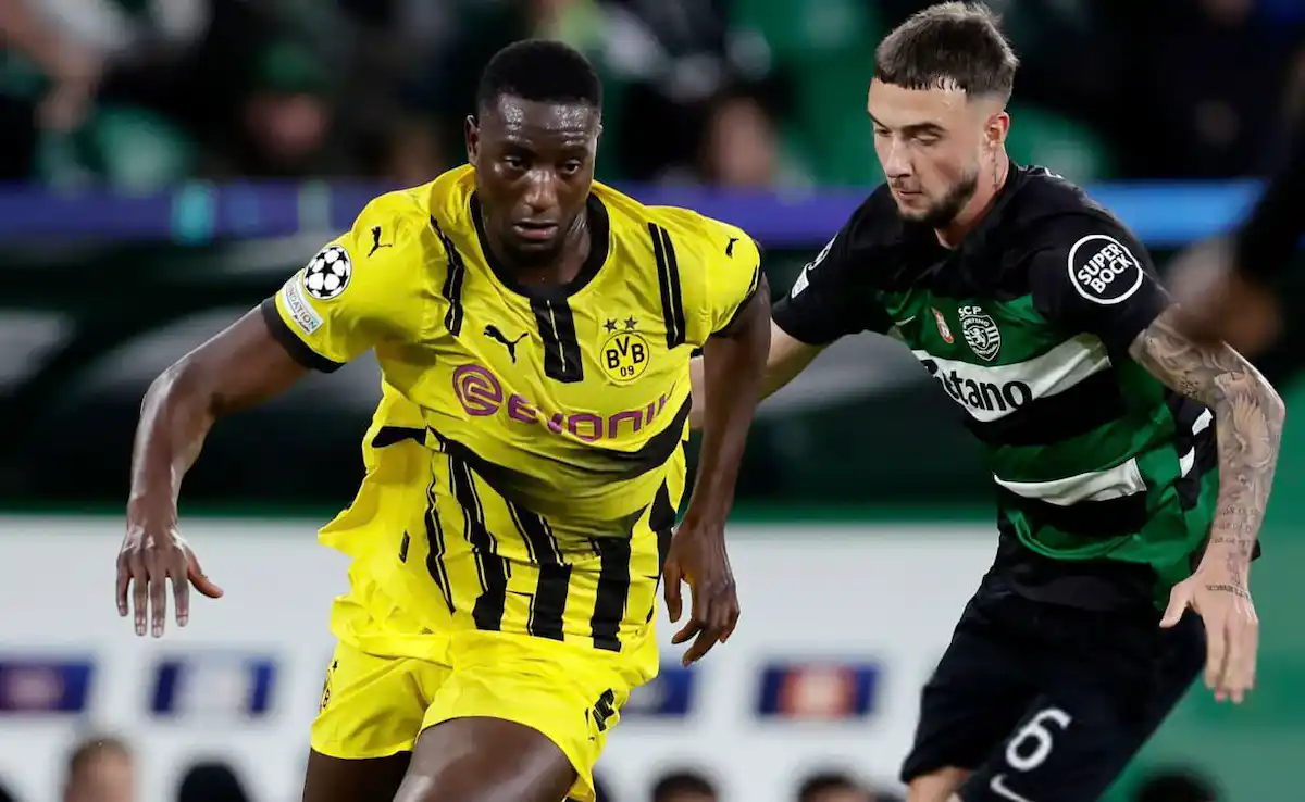 Borussia's Serhou Guirassy and Sporting's Zeno Debast during the Champions League clash between the two teams