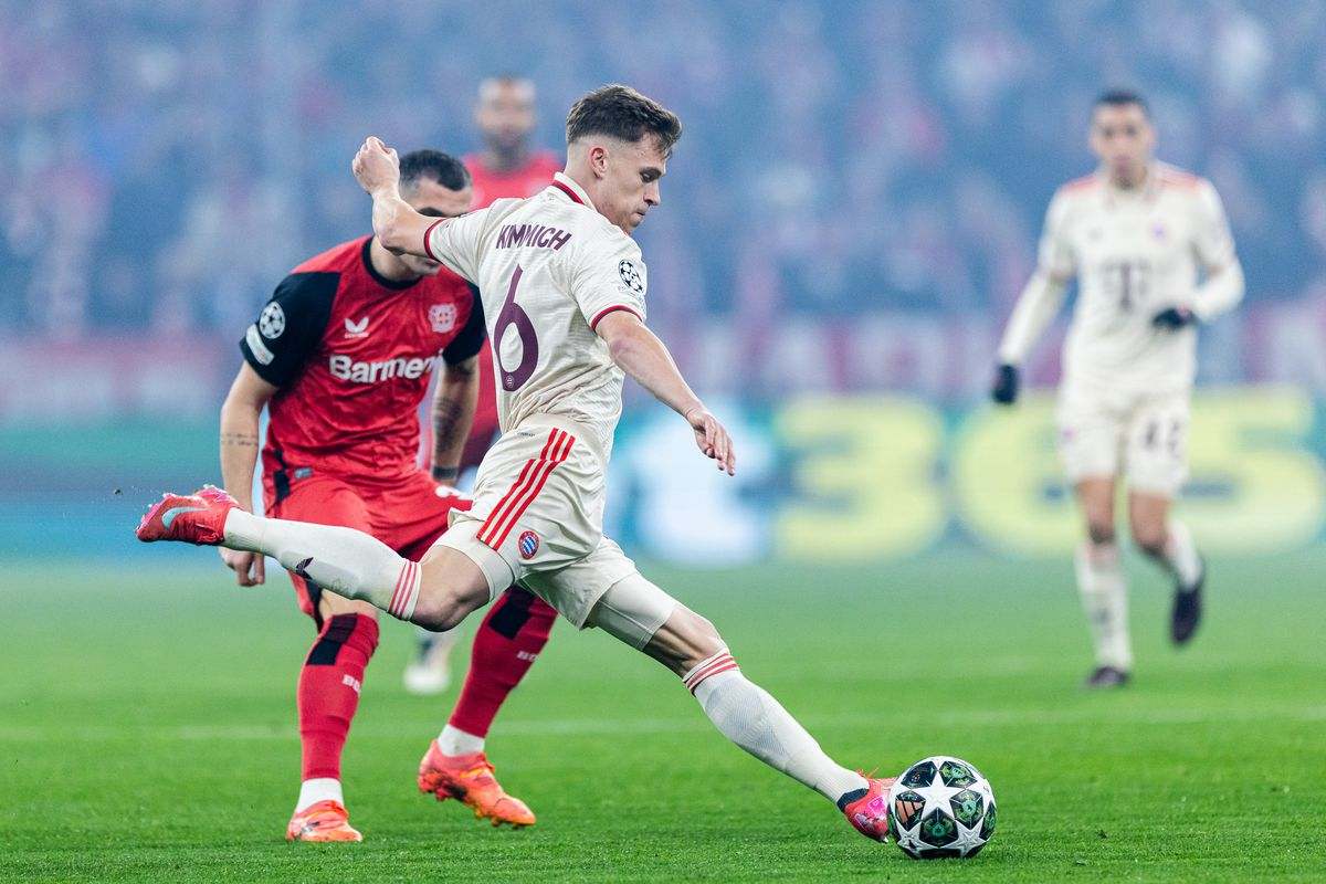 Joshua Kimmich shoots towards Bayer Leverkusen's net in a Champions League 1/8 final clash