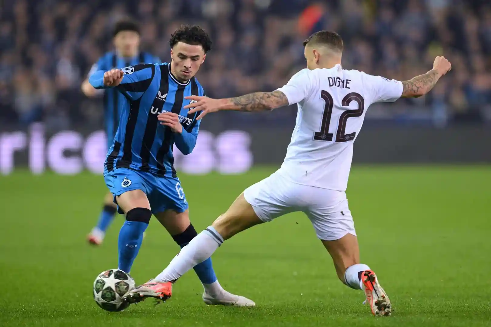 Aston Villa's Lucas Digne trying to get the ball from a Club Brugge player