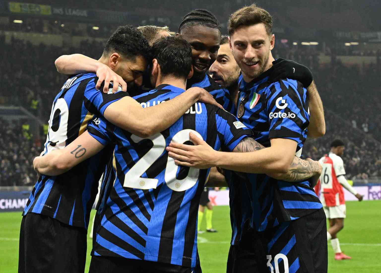 Inter players celebrate after scoring against Feyenoord