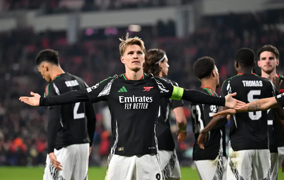 Martin Odegaard celebrates after scoring against PSV in the Champions League